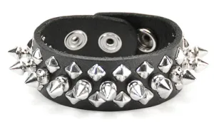 Black leather bracelet w/ 1 row of silver tree spikes and 2 rows of diamond shaped silver studs