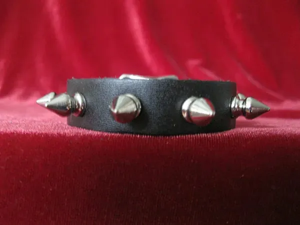 Black leather bracelet w/ single row of silver spikes