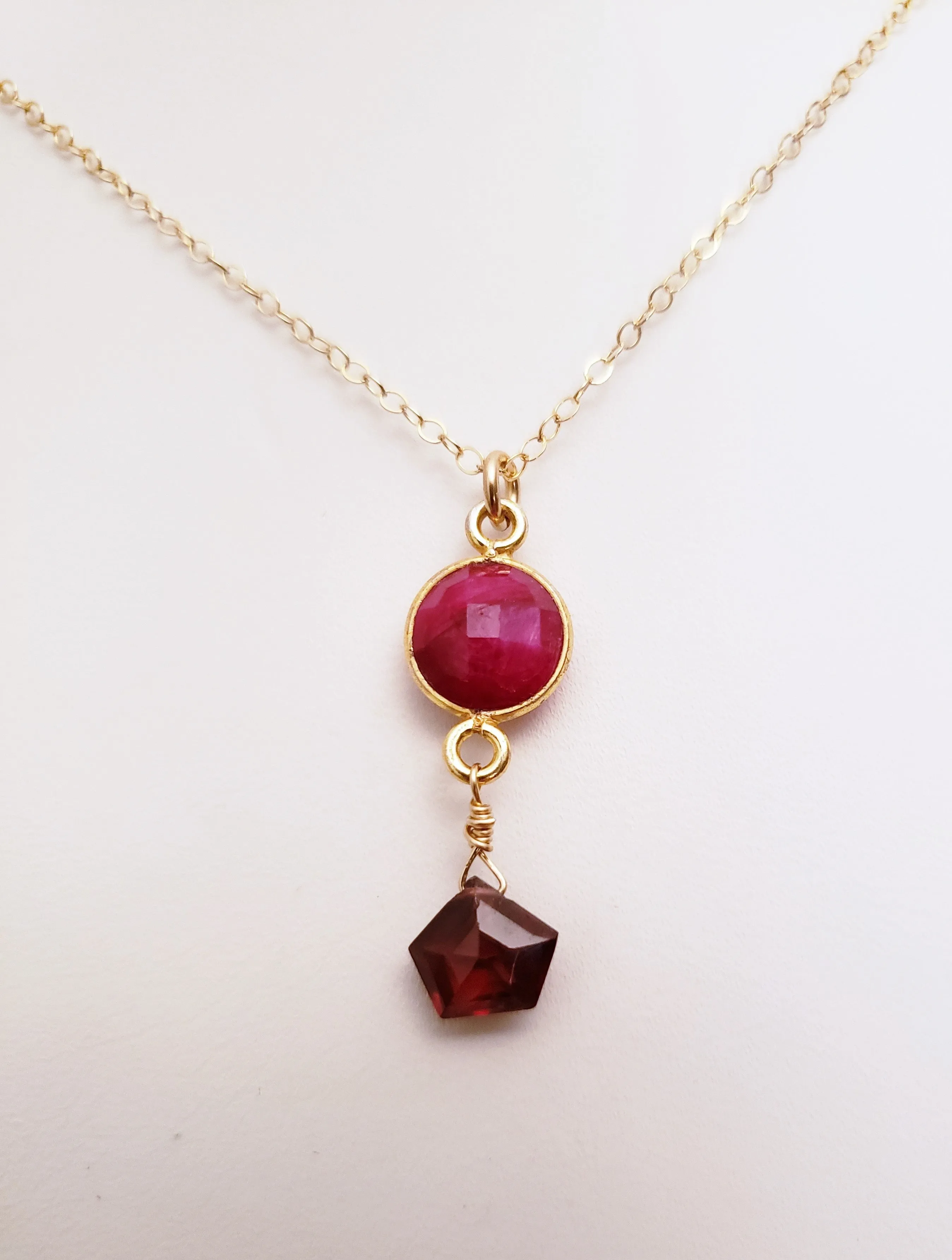 Delicate Pendant Necklace Features a Faceted Bezel Set Ruby With a Faceted Garnet Tear Drop on a Fine Gold-Filled Chain.