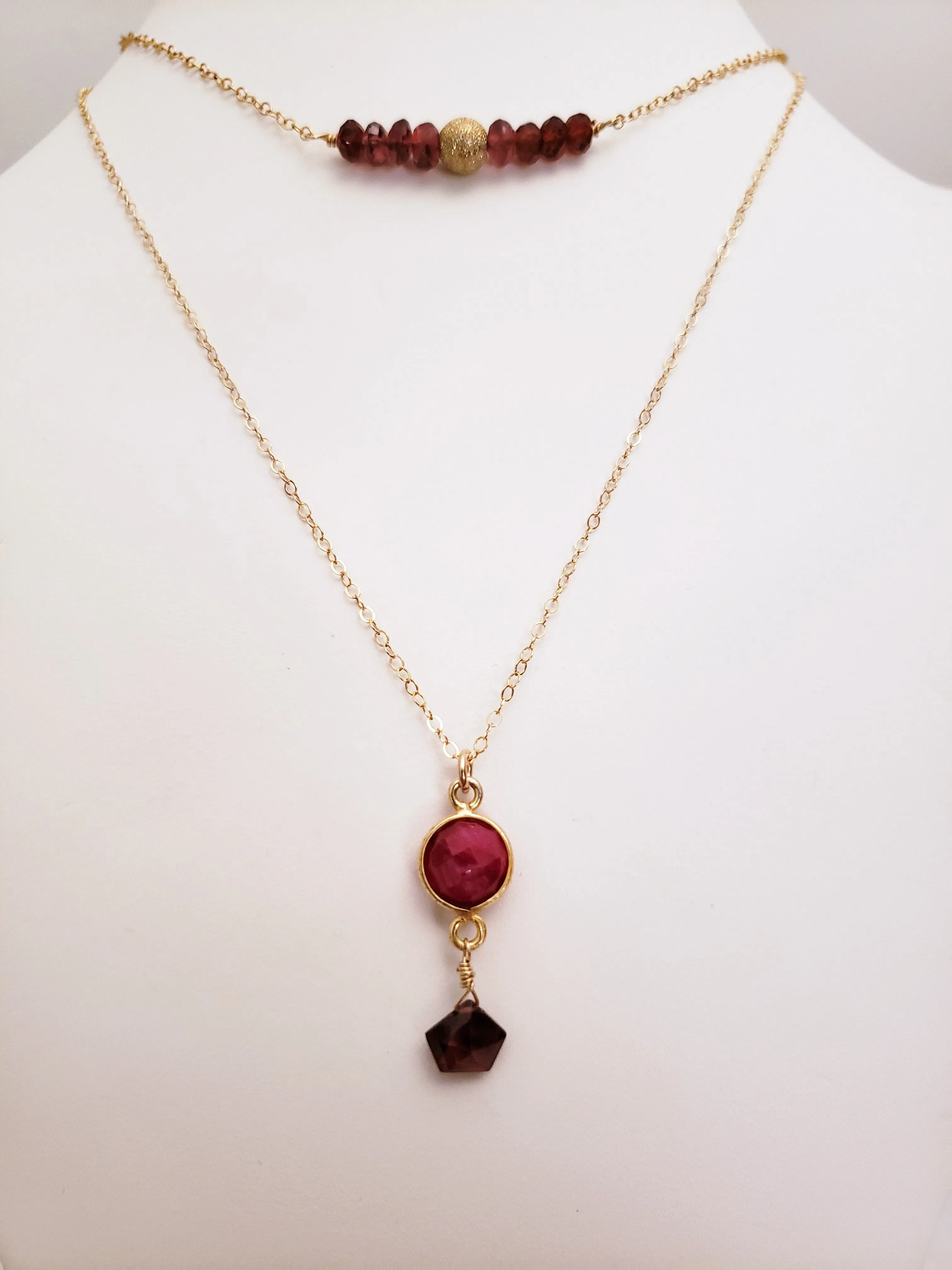 Delicate Pendant Necklace Features a Faceted Bezel Set Ruby With a Faceted Garnet Tear Drop on a Fine Gold-Filled Chain.