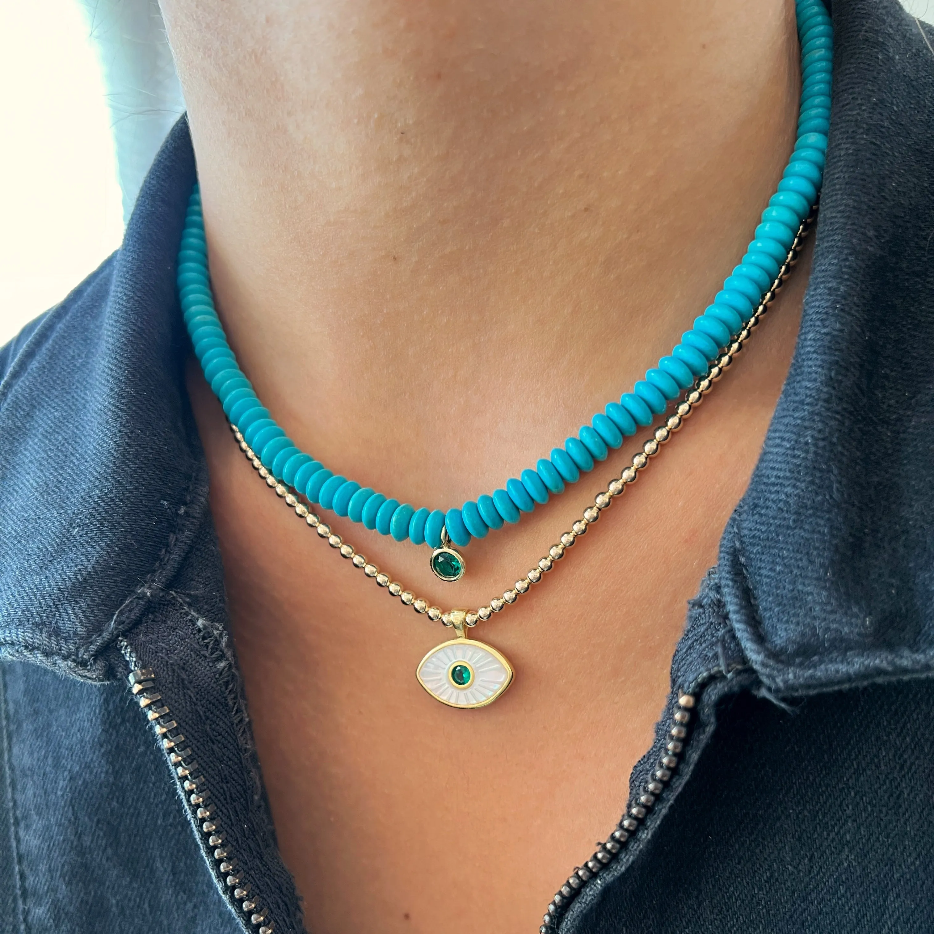 Turquoise Puka with Emerald Bezel
